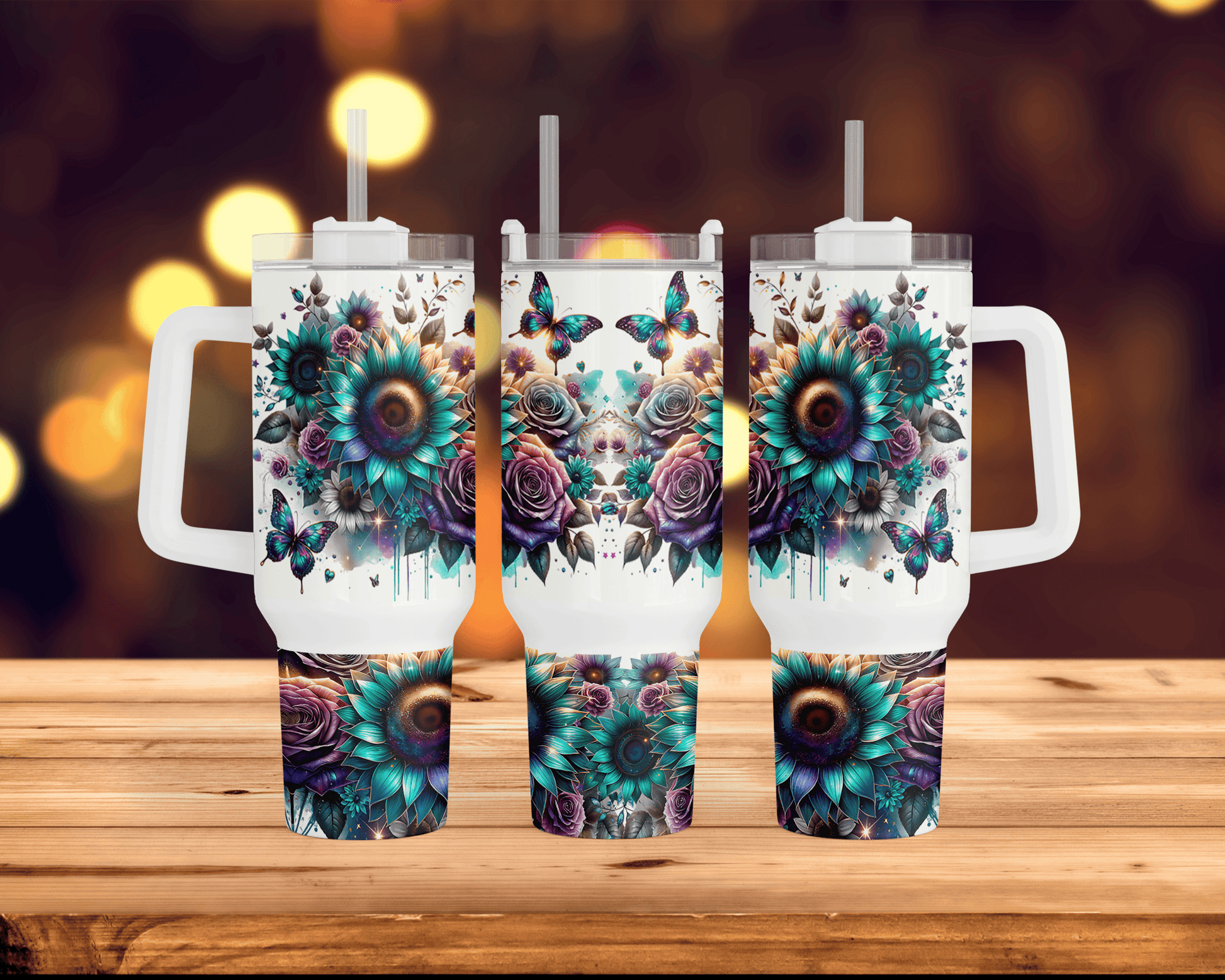 three travel mugs with floral designs on them