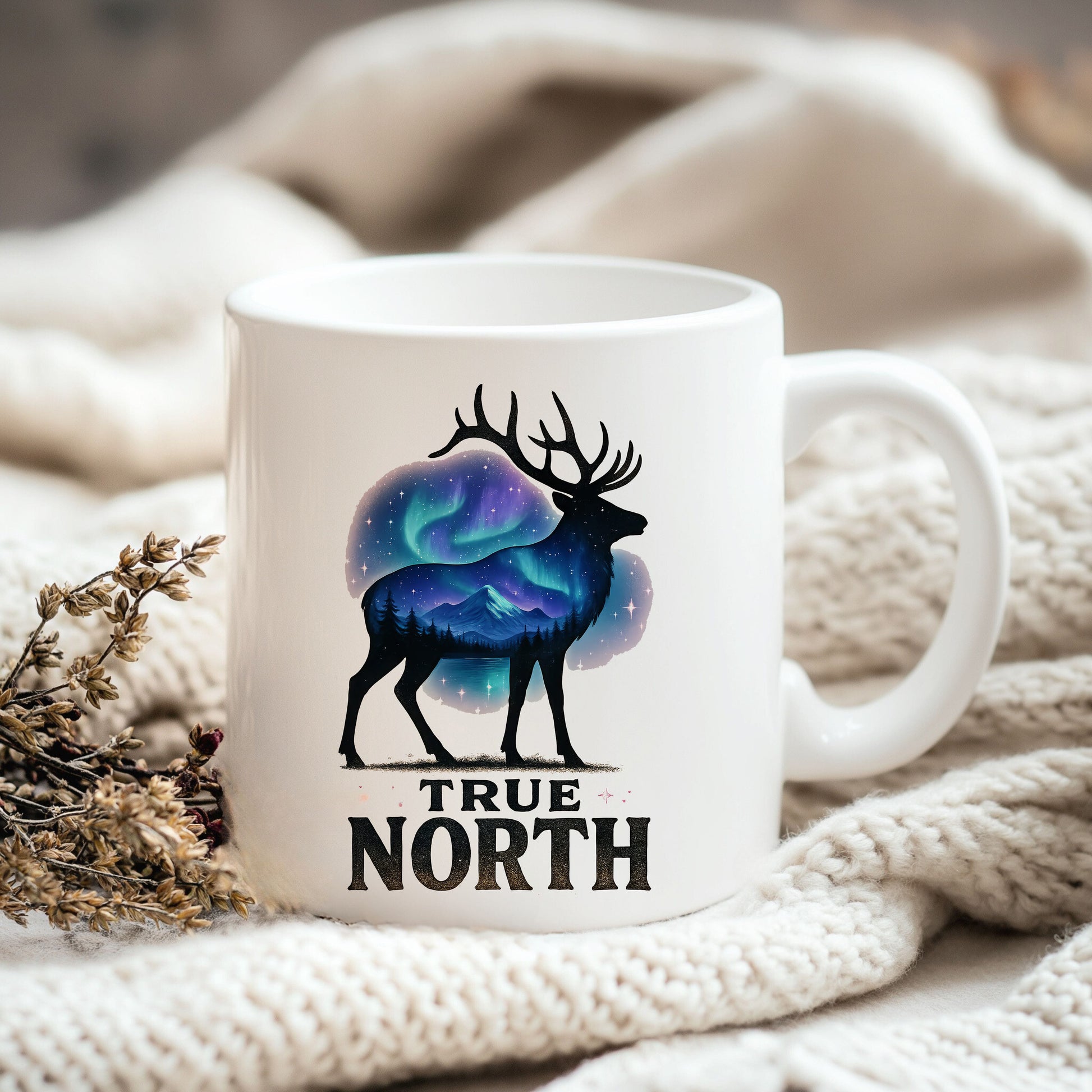 a white coffee mug with the words true north on it