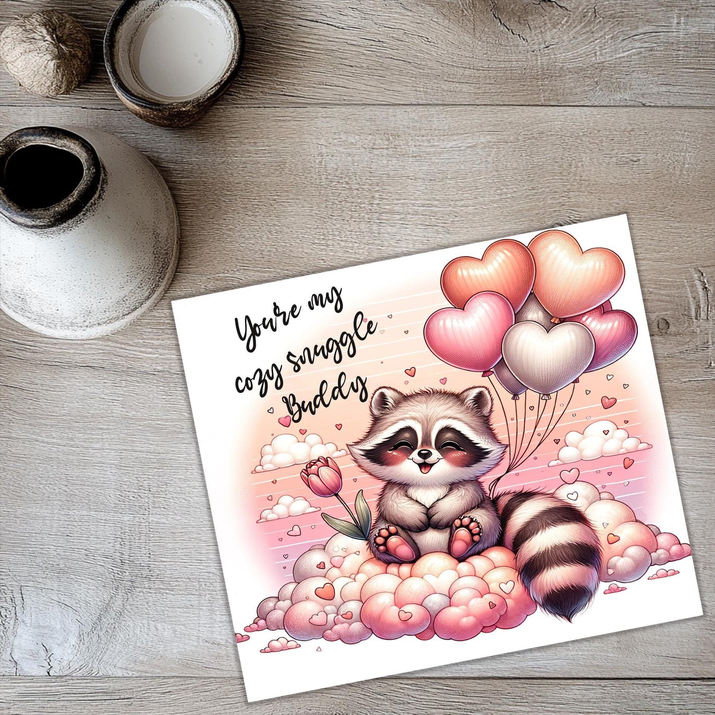 a card with a raccoon holding a bunch of balloons